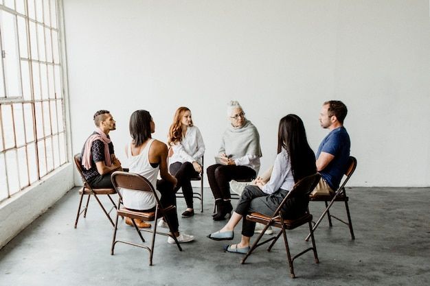 a group of people sitting in chairs