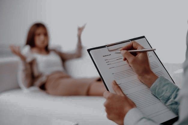 a person holding a pen and clipboard